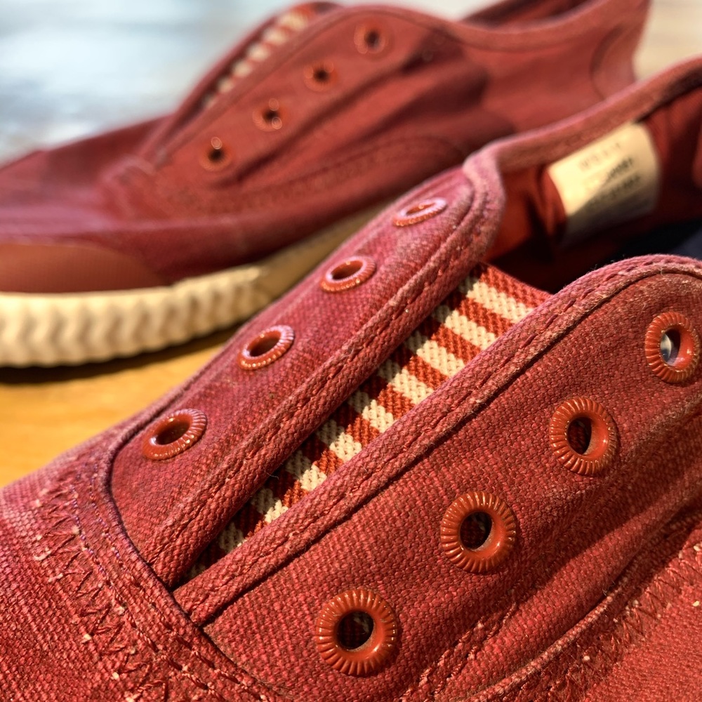 Red and white Sperry canvas laceless slip on shoes